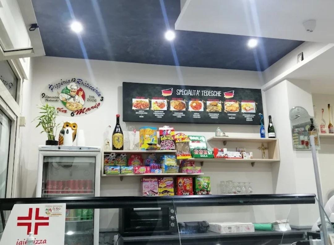 Bancone e insegna delle specialità tedesche